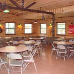 HUTCHINS.  Seats 100.  Chairs around tables.  Podium.  Tile Floor.